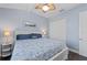 Bedroom with closet, ceiling fan, wood floors and white trim at 315 Sapphire Lake Dr # 202, Bradenton, FL 34209