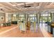 A well-lit clubhouse interior with comfortable seating areas and views of the waterfront at 315 Sapphire Lake Dr # 202, Bradenton, FL 34209