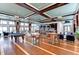 A clubhouse interior featuring a bar, pool table, lounge seating, and panoramic waterfront views at 315 Sapphire Lake Dr # 202, Bradenton, FL 34209