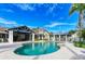 Enjoy this community pool with a covered patio, lounge seating, and scenic views, perfect for relaxation and recreation at 315 Sapphire Lake Dr # 202, Bradenton, FL 34209
