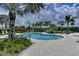 Enjoy this inviting community pool surrounded by lush landscaping and comfortable lounge seating, perfect for relaxation at 315 Sapphire Lake Dr # 202, Bradenton, FL 34209