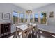 Sunny dining area with a chandelier, wood floors, and lots of natural light at 315 Sapphire Lake Dr # 202, Bradenton, FL 34209
