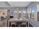 Bright dining area with a chandelier, wood floors, and lots of natural light at 315 Sapphire Lake Dr # 202, Bradenton, FL 34209