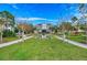 Stunning two-story home featuring a manicured lawn and centered water feature with inviting walking paths at 315 Sapphire Lake Dr # 202, Bradenton, FL 34209