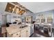 Open concept kitchen featuring granite counters, stainless appliances and adjacent dining and living areas at 315 Sapphire Lake Dr # 202, Bradenton, FL 34209
