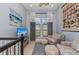 Bright living room features comfortable seating, beach decor, and natural lighting at 315 Sapphire Lake Dr # 202, Bradenton, FL 34209