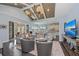Open living area features hardwood floors, vaulted ceilings, view of kitchen, and comfortable seating at 315 Sapphire Lake Dr # 202, Bradenton, FL 34209