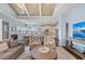 Bright living room features hardwood floors and is open to kitchen and dining area at 315 Sapphire Lake Dr # 202, Bradenton, FL 34209