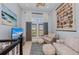 Cozy living room featuring beach decor, comfortable seating and bright natural light at 315 Sapphire Lake Dr # 202, Bradenton, FL 34209