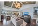Bright living room features vaulted ceilings with fan, hardwood floors, and an open floor plan at 315 Sapphire Lake Dr # 202, Bradenton, FL 34209