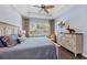 Light and airy main bedroom with beautiful flooring, plantation shutters and ceiling fan at 315 Sapphire Lake Dr # 202, Bradenton, FL 34209