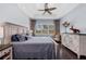 Light and airy main bedroom with beautiful flooring, plantation shutters and ceiling fan at 315 Sapphire Lake Dr # 202, Bradenton, FL 34209