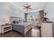 Light and airy main bedroom with beautiful flooring, plantation shutters and ceiling fan at 315 Sapphire Lake Dr # 202, Bradenton, FL 34209