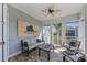 Comfortable sunroom with neutral furniture, ceiling fan, and outdoor views at 315 Sapphire Lake Dr # 202, Bradenton, FL 34209