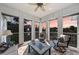 A cozy, well-lit sunroom with comfortable seating and views of the surrounding landscape at 315 Sapphire Lake Dr # 202, Bradenton, FL 34209