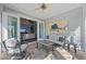 Inviting Sunroom with views to the living room, neutral furnishings and coastal decor at 315 Sapphire Lake Dr # 202, Bradenton, FL 34209