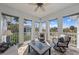 Inviting sunroom bathed in sunlight with views of lush landscaping and white trim at 315 Sapphire Lake Dr # 202, Bradenton, FL 34209