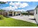 A full backyard with an outdoor seating area and a custom built shed at 3458 Lalani Blvd, Sarasota, FL 34232