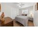 Cozy bedroom with wood-look flooring, neutral decor, and a ceiling fan at 3458 Lalani Blvd, Sarasota, FL 34232
