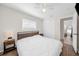 Bright bedroom with wood-look floors, a closet, and a ceiling fan at 3458 Lalani Blvd, Sarasota, FL 34232