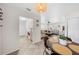 Bright dining area open to living space, featuring a ceiling fan and tile flooring at 3458 Lalani Blvd, Sarasota, FL 34232