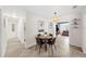 Comfortable dining area featuring a pendant light, modern table set, and tile floors at 3458 Lalani Blvd, Sarasota, FL 34232