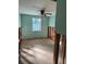 Bedroom with wood floors, window view, exposed walls, awaiting renovations and customization at 3808 118Th W St, Bradenton, FL 34210