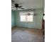 Bedroom with wood floors, window view, exposed walls, awaiting renovations and customization at 3808 118Th W St, Bradenton, FL 34210