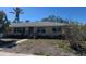 Well-maintained single-Gathering home with a xeriscaped front yard and a covered entry way at 3808 118Th W St, Bradenton, FL 34210