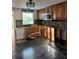 Bright kitchen features custom cabinets, stone backsplash, and stainless appliances at 3808 118Th W St, Bradenton, FL 34210