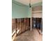 Open-concept living room featuring hardwood floors and bright light, awaiting renovations and customization at 3808 118Th W St, Bradenton, FL 34210