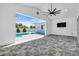 Open lanai leads to a refreshing pool surrounded by lush landscaping at 3925 Bell Ave, Sarasota, FL 34231