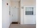 Condo entrance with charming 'Cheers' doormat, window, and a view of the building's exterior at 4208 Central Sarasota Pkwy # 1422, Sarasota, FL 34238