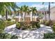 Beautiful condominium exterior with lush landscaping, fountain, and private balconies on both floors at 4208 Central Sarasota Pkwy # 1422, Sarasota, FL 34238
