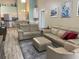 Open living room with view to the kitchen, modern furniture, and access to the outdoor lanai at 4208 Central Sarasota Pkwy # 1422, Sarasota, FL 34238