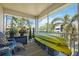 Relaxing screened patio showcasing comfortable seating, two kayaks, and scenic views at 4208 Central Sarasota Pkwy # 1422, Sarasota, FL 34238