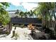 Serene backyard retreat featuring a stone-paved pathway and comfortable seating areas at 433 N Osprey Ave, Sarasota, FL 34236