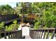 Secluded backyard patio area with mature landscaping, dark wood fencing, and brick pavers, perfect for outdoor relaxation at 433 N Osprey Ave, Sarasota, FL 34236