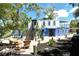 Charming backyard retreat with cozy seating and lush landscaping, perfect for relaxation at 433 N Osprey Ave, Sarasota, FL 34236