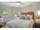 Bright bedroom with a ceiling fan, multiple windows, and wicker headboard at 433 N Osprey Ave, Sarasota, FL 34236