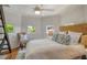 Bright bedroom with white walls and wooden floors, as well as three windows at 433 N Osprey Ave, Sarasota, FL 34236