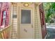 Charming front entrance with light yellow planks and the house number clearly displayed on the front door at 433 N Osprey Ave, Sarasota, FL 34236