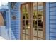 Charming entryway with glass paneled doors, a 'Welcome Aboard' sign, and a glimpse into the home's interior at 433 N Osprey Ave, Sarasota, FL 34236