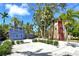 Unique compound with quaint cottages and lush tropical landscaping on a sunny day at 433 N Osprey Ave, Sarasota, FL 34236