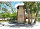 Unique multi-story home featuring a light house style design with mature landscaping at 433 N Osprey Ave, Sarasota, FL 34236