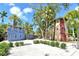 Unique beach home featuring tropical landscaping and colorful exterior at 433 N Osprey Ave, Sarasota, FL 34236