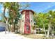 Unique multi-story home featuring a light house style design with lots of tropical landscaping at 433 N Osprey Ave, Sarasota, FL 34236