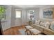 Cozy living room with natural light, hardwood floors, and comfortable seating next to the windows at 433 N Osprey Ave, Sarasota, FL 34236
