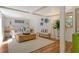 Bright living room with neutral furniture, stylish decor and hardwood floors at 433 N Osprey Ave, Sarasota, FL 34236