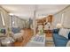 Open-concept living space with spiral staircase, breakfast bar and hardwood floors, perfect for entertaining at 433 N Osprey Ave, Sarasota, FL 34236